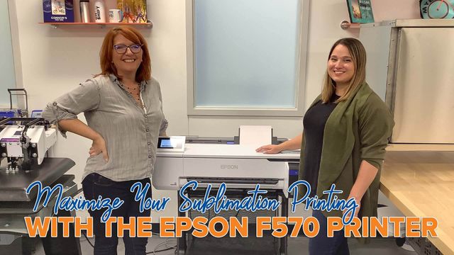 two people standing by epson printer