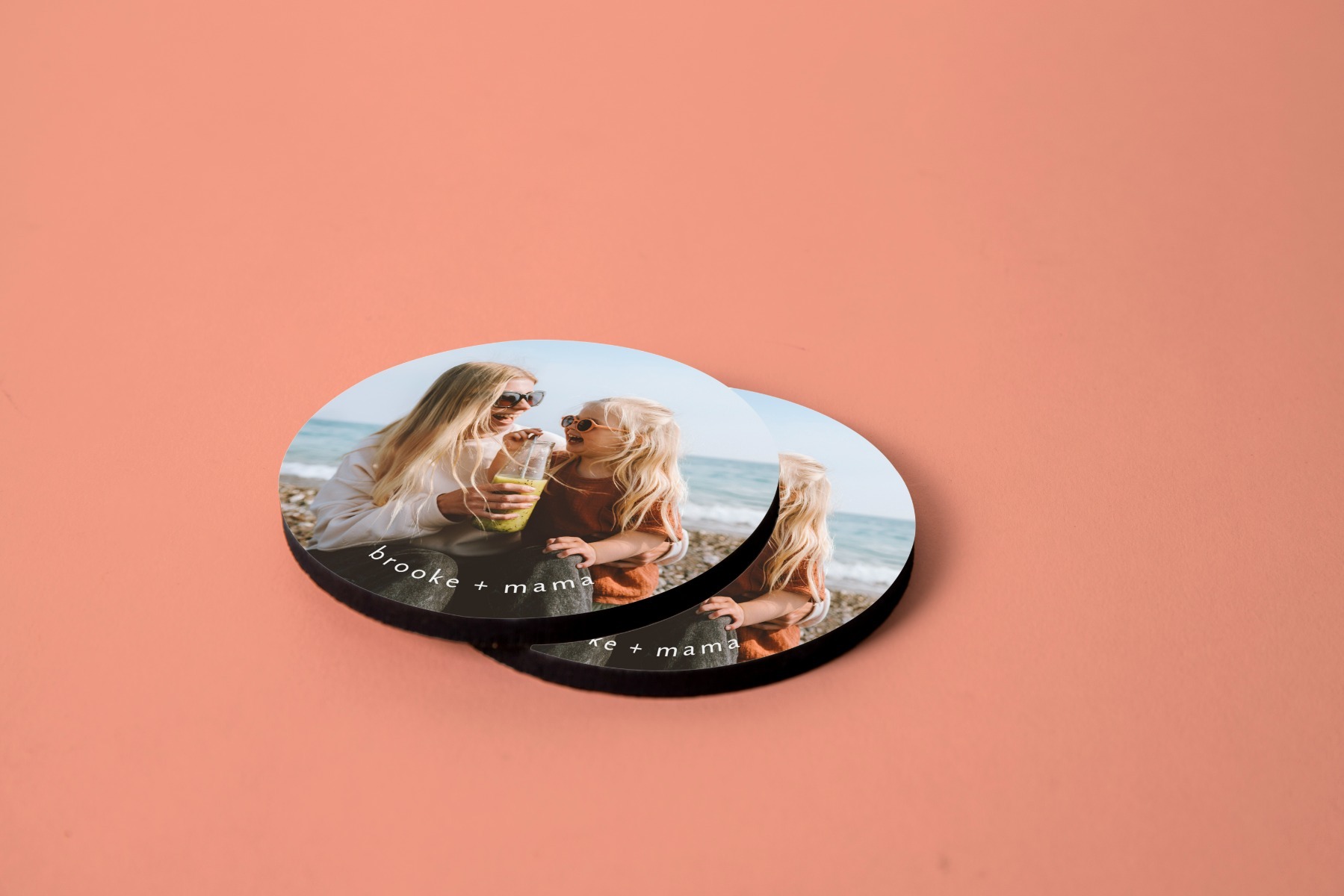 Two decorated round coasters stacked
