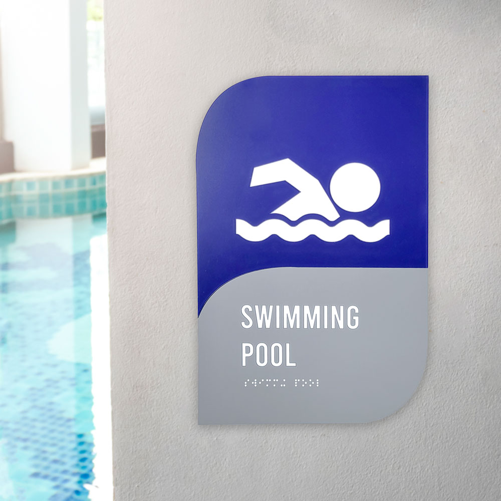 Swimming pool sign hanging on wall