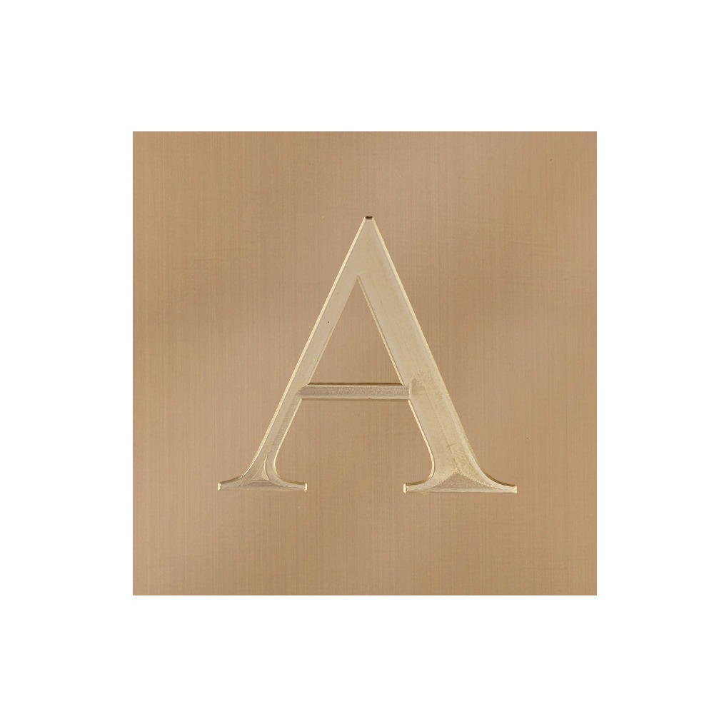 Letter A engraved on bright gold brass sheet
