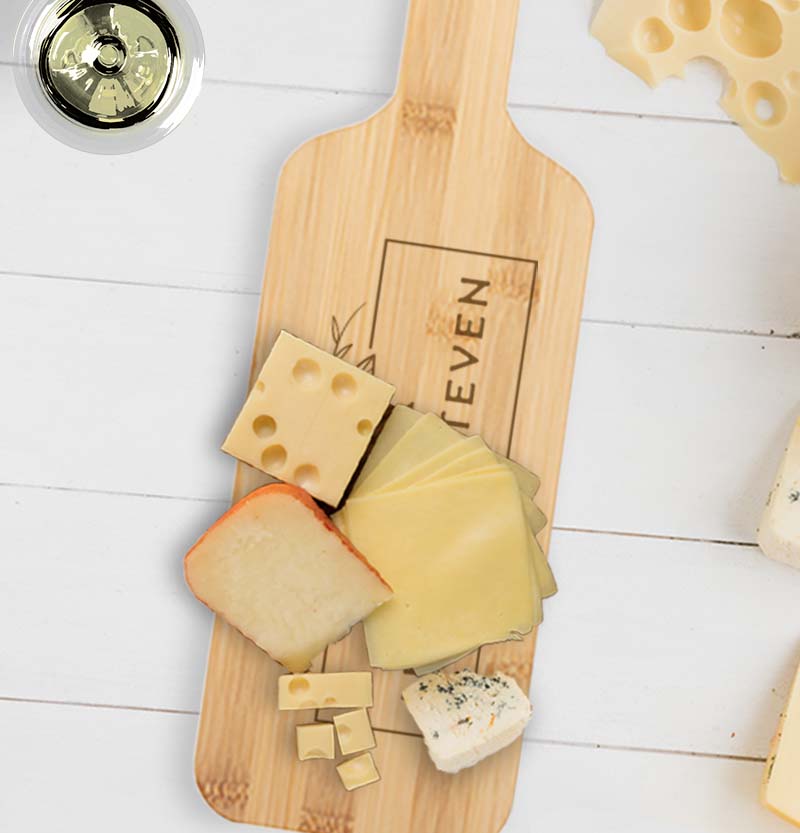 Serving board paddle with cheese on it
