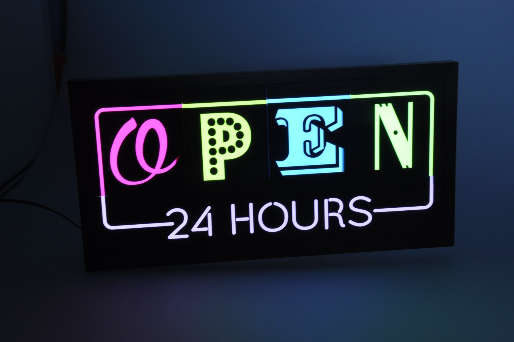 Back-lit Open 24 Hours sign