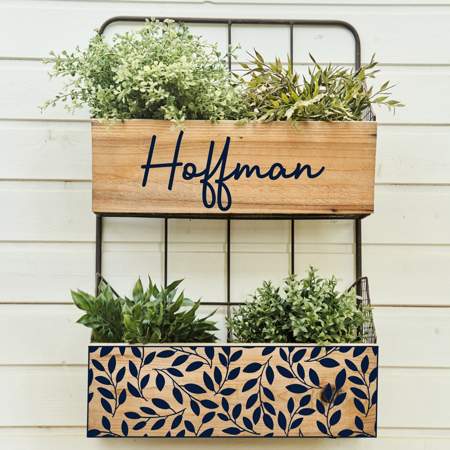 Planter boxes with Hoffman name and leaf design