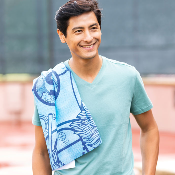 man with towel over shoulder