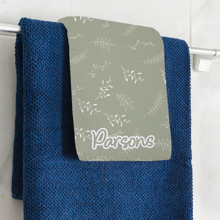 hanging towel with Parsons print over blue towel