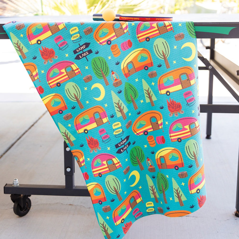 Camping design towel hanging on side of a table