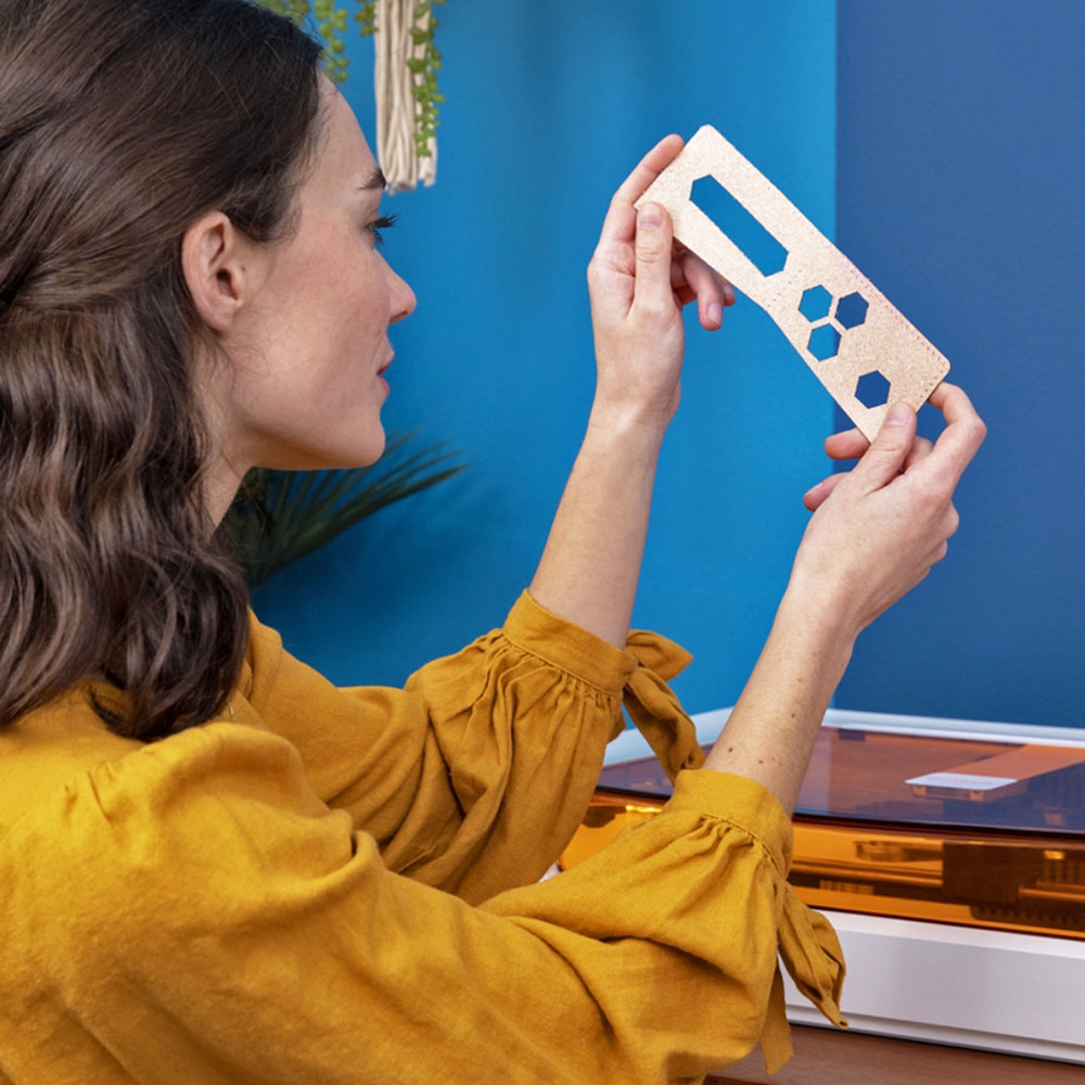 Woman inspecting engraved piece