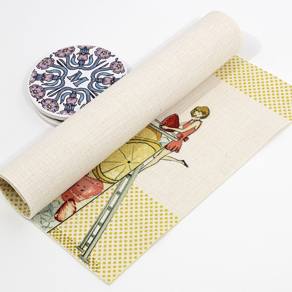 Rolled up linen placemat next to coasters