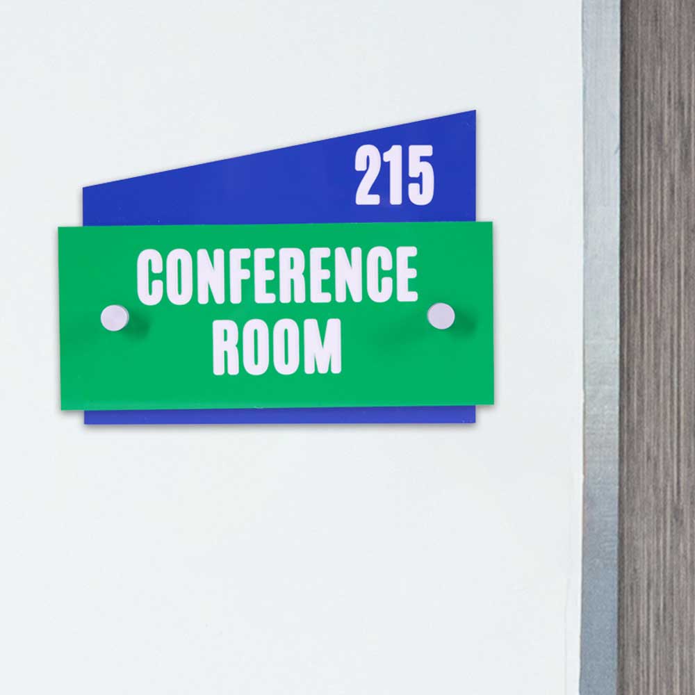 Conference room sign hanging on wall