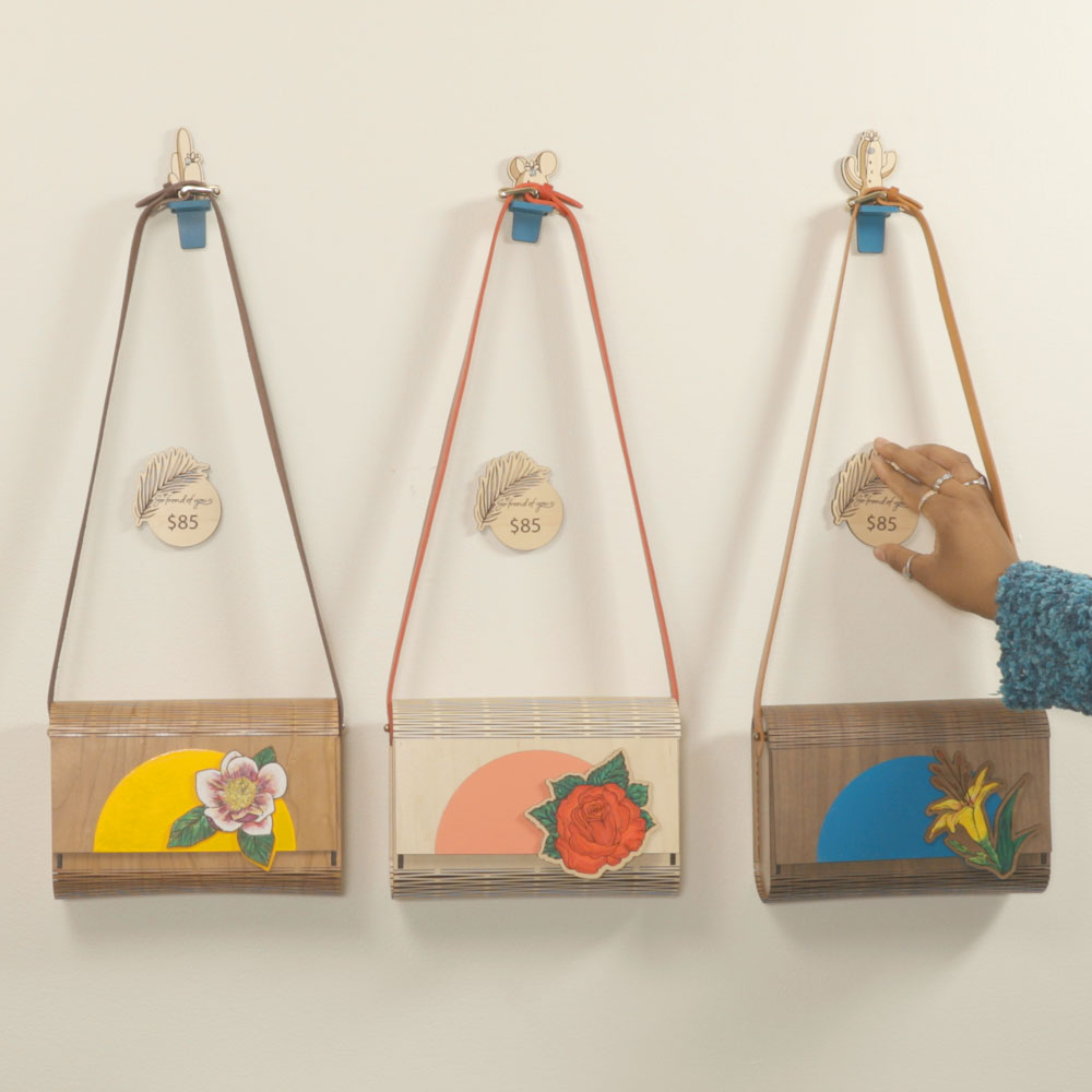 Wooden purses hanging on wall
