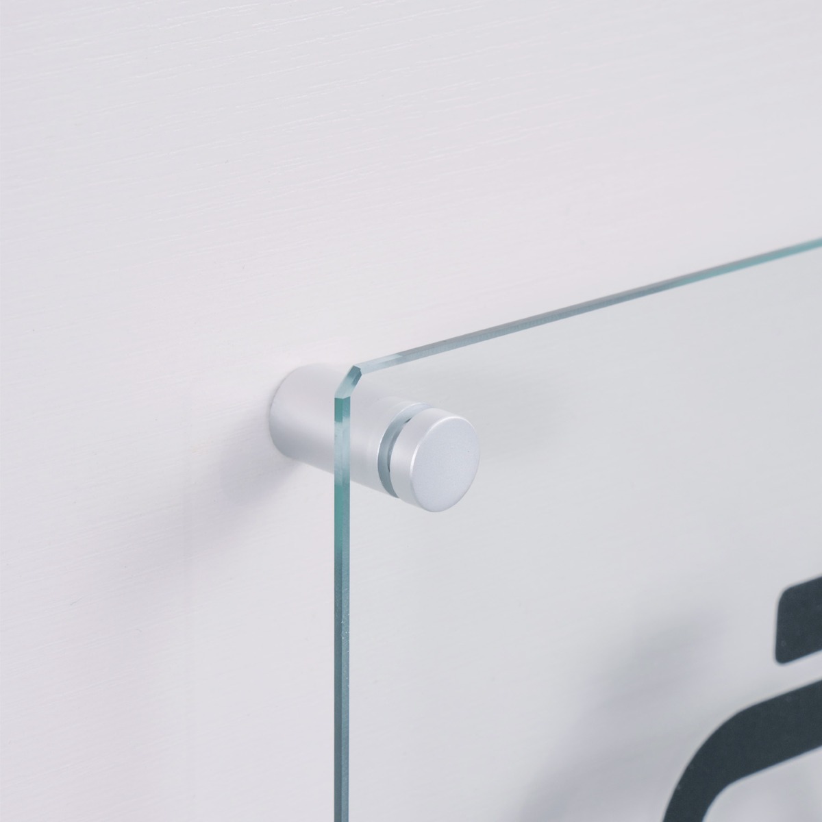 Sign being held up with satin silver standoffs