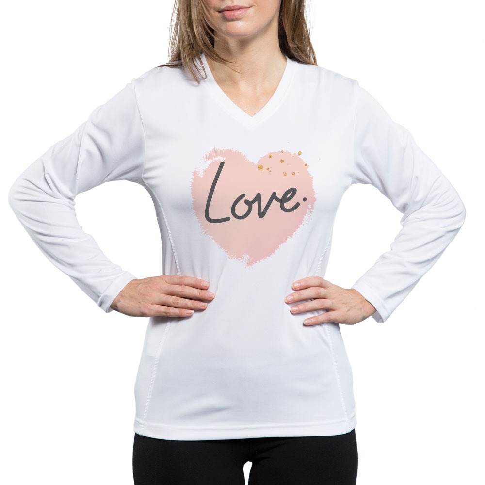 woman wearing white long sleeve shirt printed with a heart