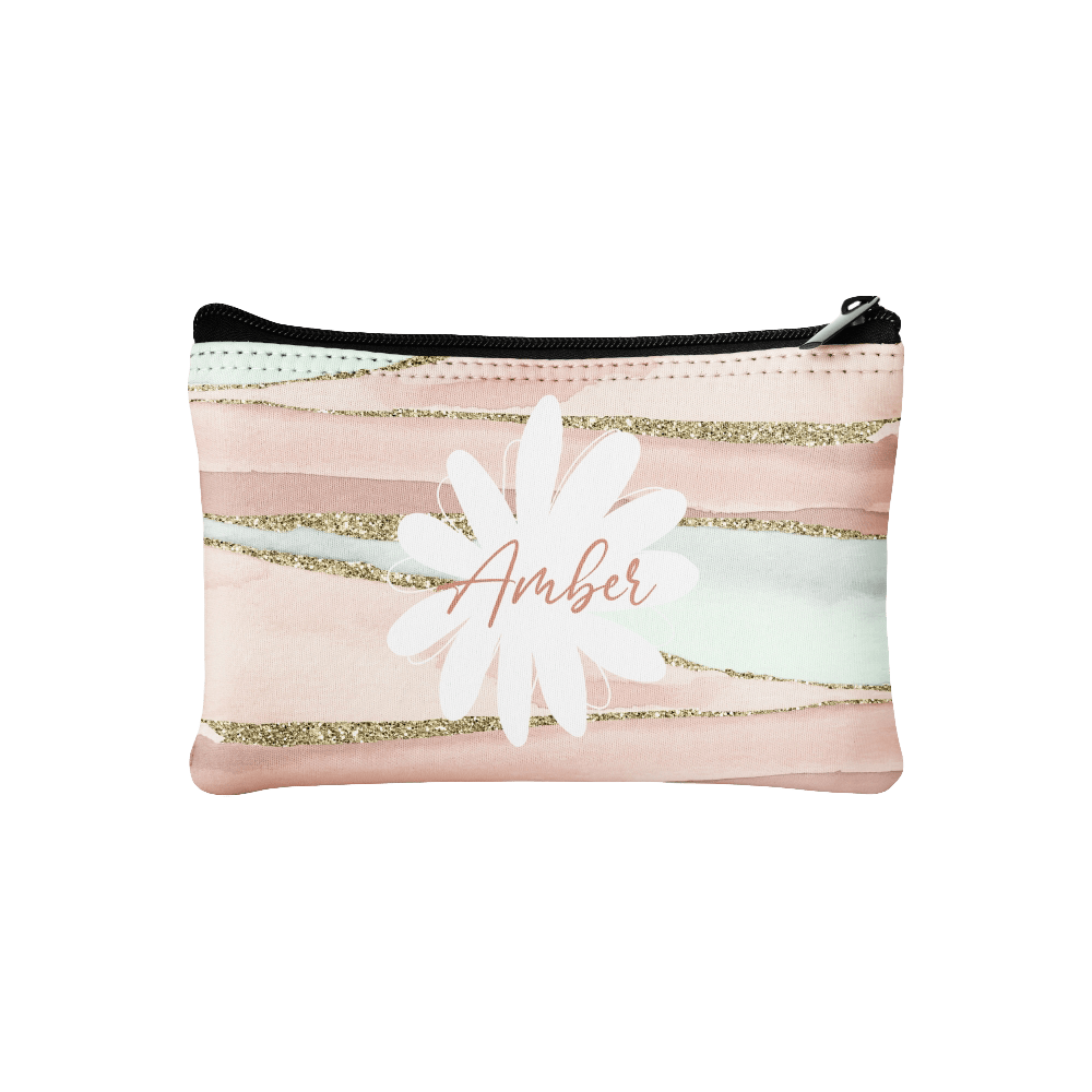 Zippered pouch with a pink pattern that says “Amber”