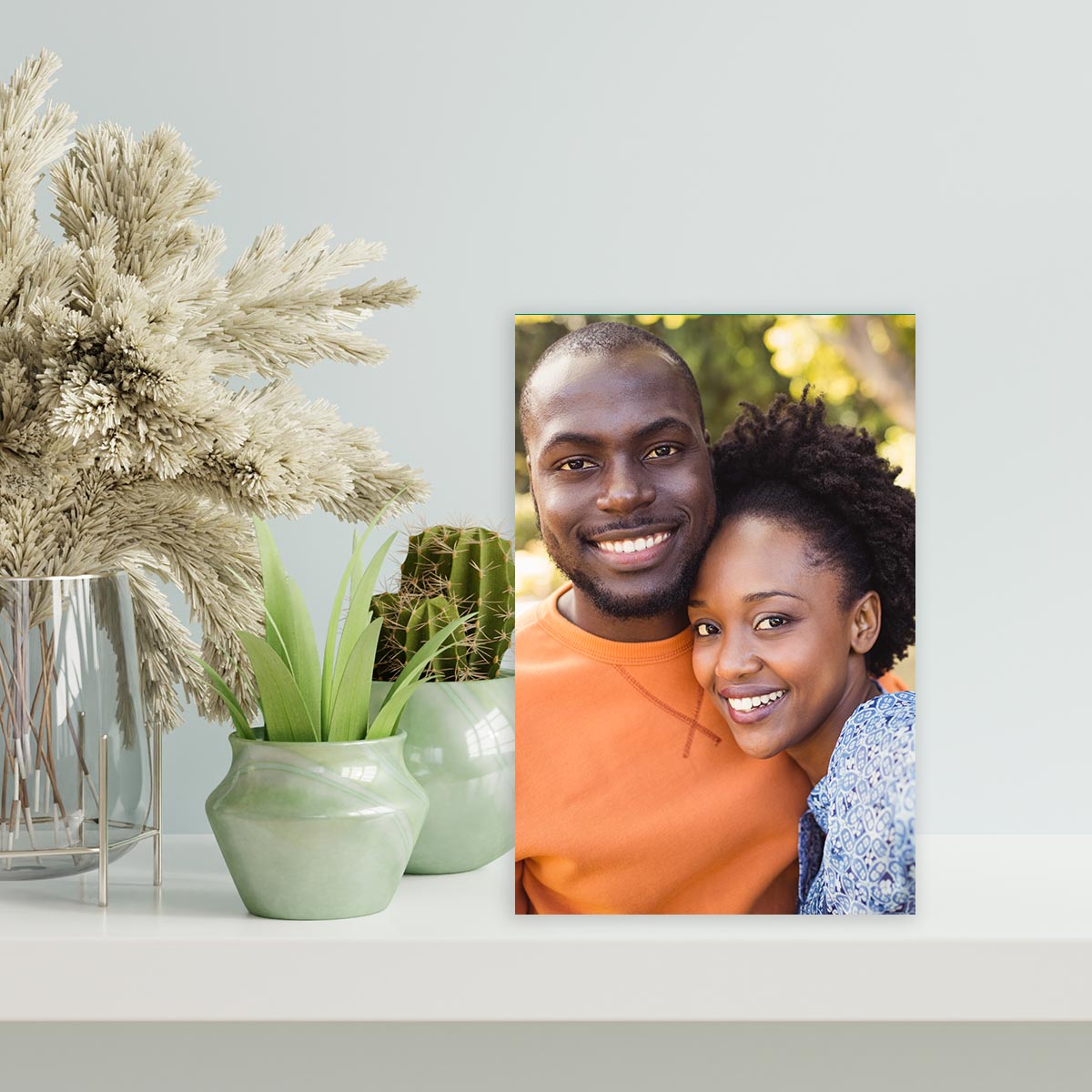 Picture of couple on aluminum easel frame sitting on table