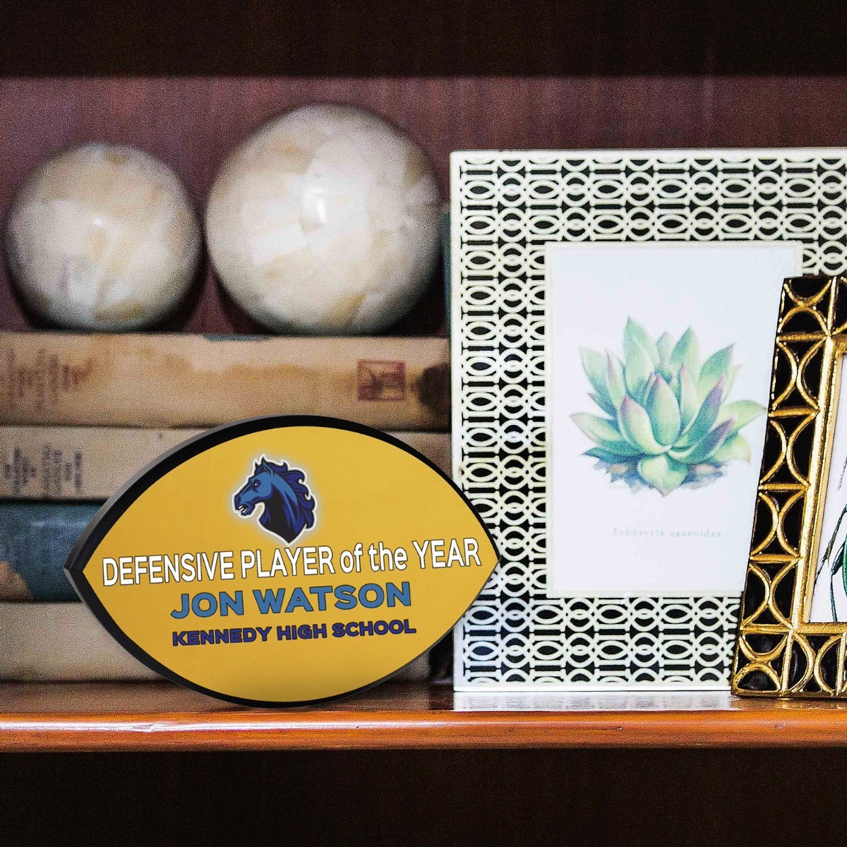 Shelf with football plaque
