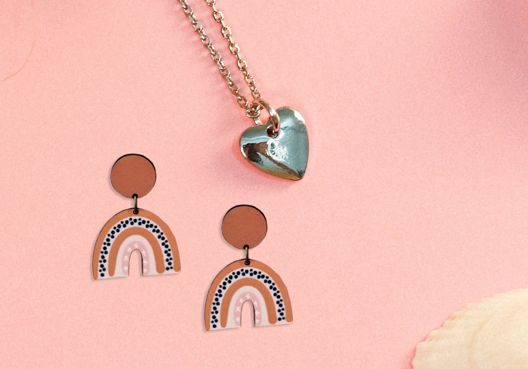 Two rainbow earrings by necklace