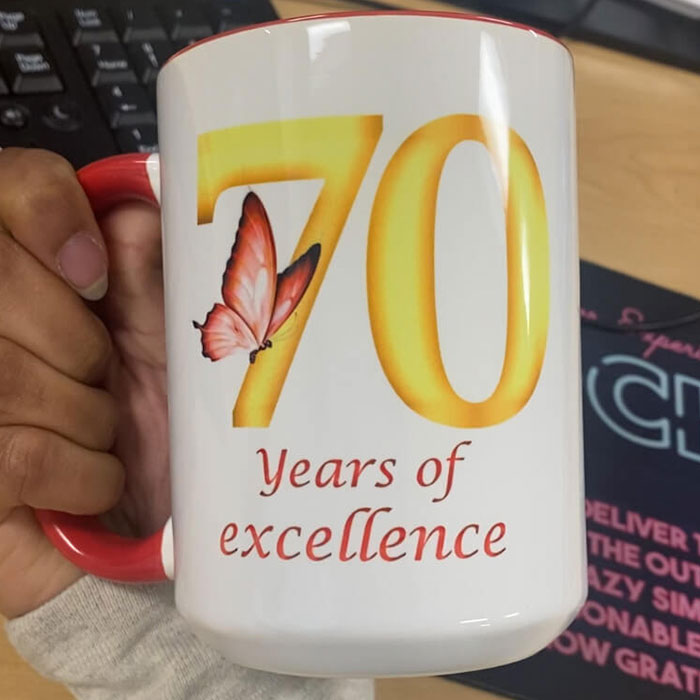 finished red inner color mug with 70 years of excellence design